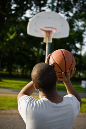 Picture Of A Kid Shooting Baskets